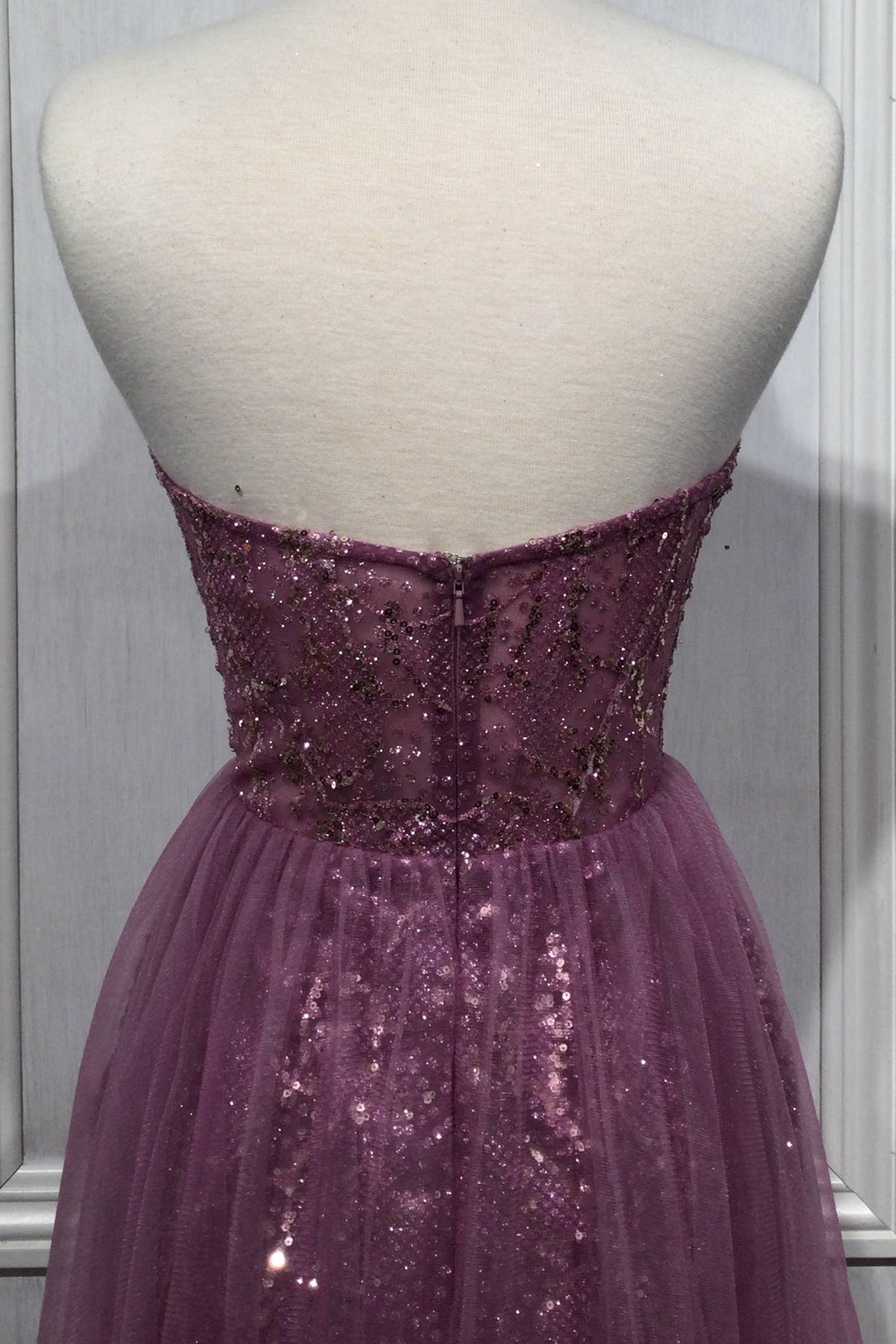 STRAPLESS EMBELLISHED GOWN WITH TULLE OVERSKIRT